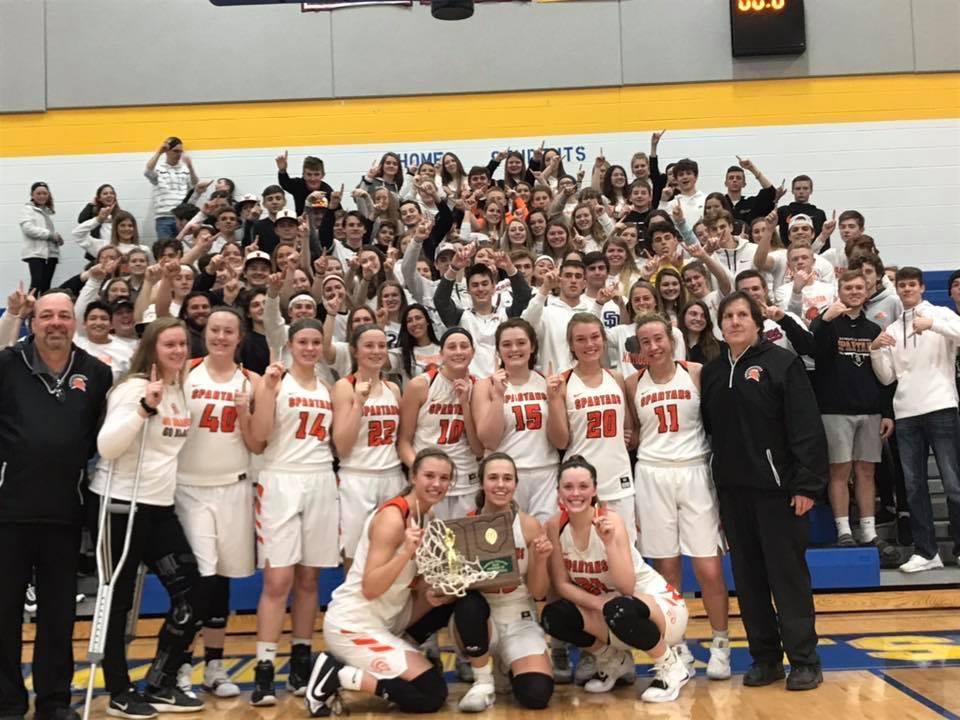 crowd with a basketball team